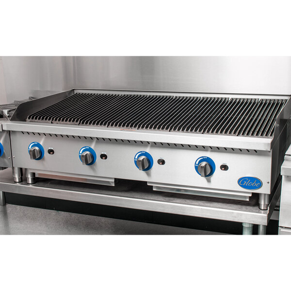 A large stainless steel Globe gas charbroiler with blue knobs.