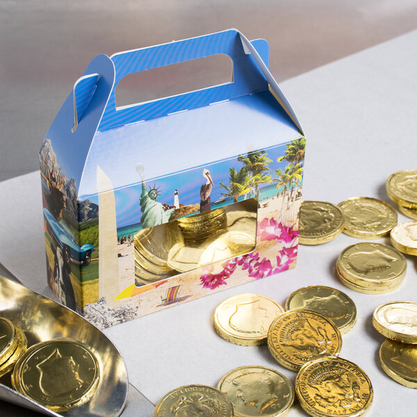 A 1/2 lb. Landscape Window Candy Box with gold coins inside.