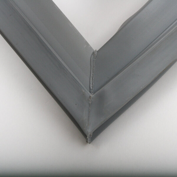 A close up of a gray metal frame for a Victory door gasket.