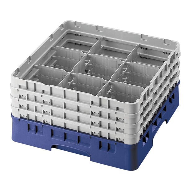 A navy blue plastic Cambro glass rack with 9 compartments and 6 extenders.