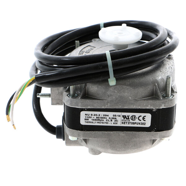 An Ice-O-Matic fan motor with black wires and a wire harness.