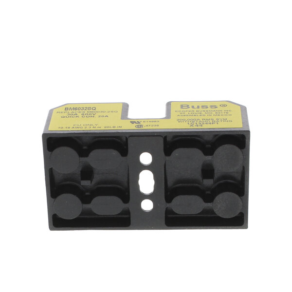 A black and yellow Champion fuse block with two yellow buttons.