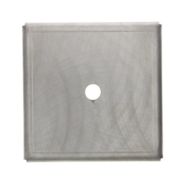 A square metal plate with a hole in the center.