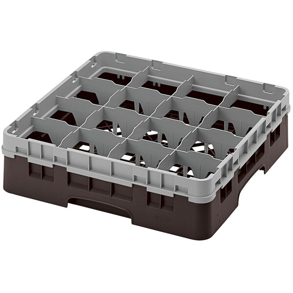 A brown plastic Cambro glass rack with 16 compartments.