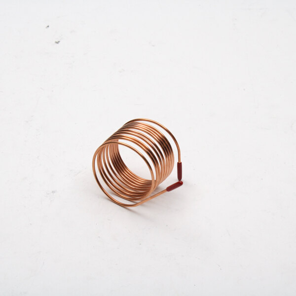 A close-up of a copper coil spring with a red wire on top.