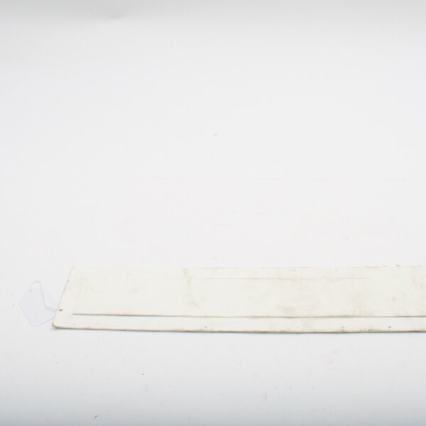 A white rectangular gasket with a plastic tag.