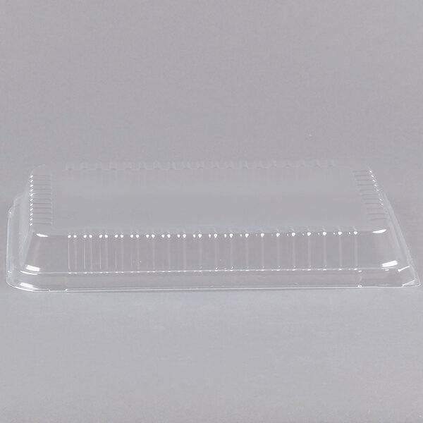 A clear plastic container with a Durable Packaging Low Dome Lid on it.