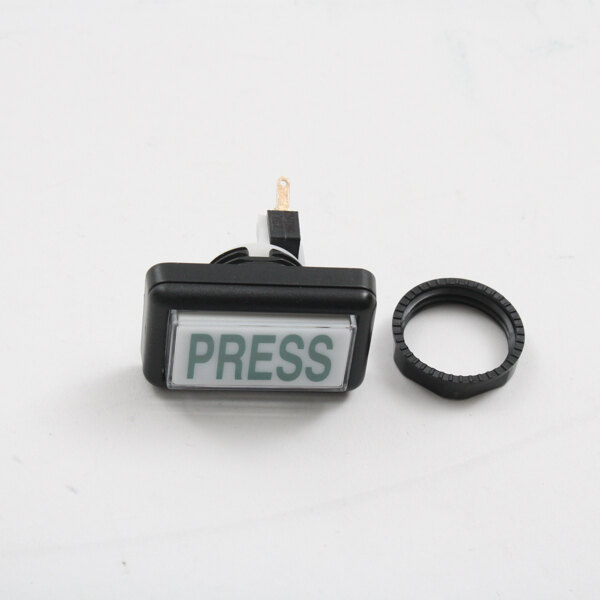A close-up of a black plastic Cornelius push button with a black plastic ring.