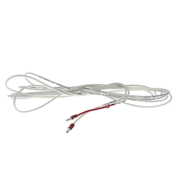 A close-up of a white cable with red wires inside.