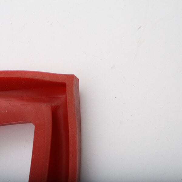 A red plastic Groen gasket corner.