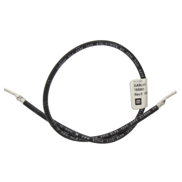 A black cable with a white connector and a black wire with a white label.