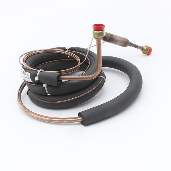 A Perlick liquid line drier with a coiled copper tube and red valve.