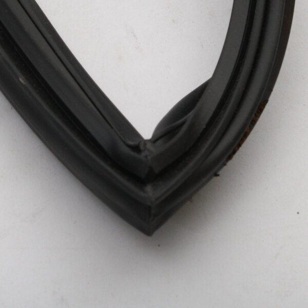 A close up of the black rubber corner of a Beverage-Air door gasket.