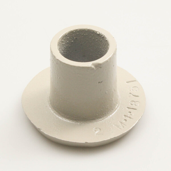 A white plastic cylindrical drive cap with a hole in it.
