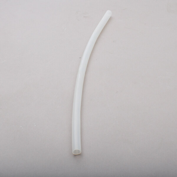 A white plastic Groen drain hose tube.