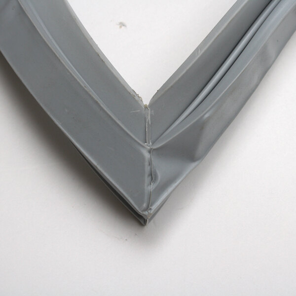 A close-up of a grey plastic Beverage-Air door gasket.