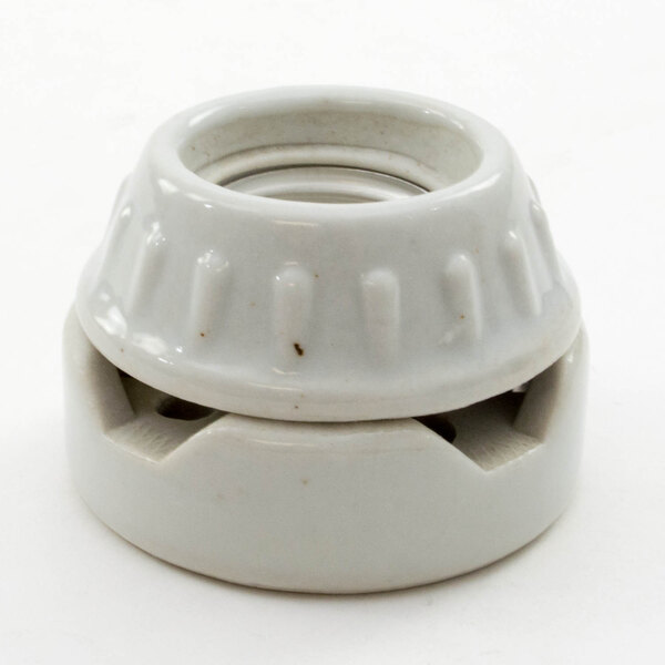 A white ceramic socket with a hole in it.