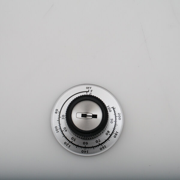 A Carter-Hoffmann knob with a black and silver dial on a white surface.