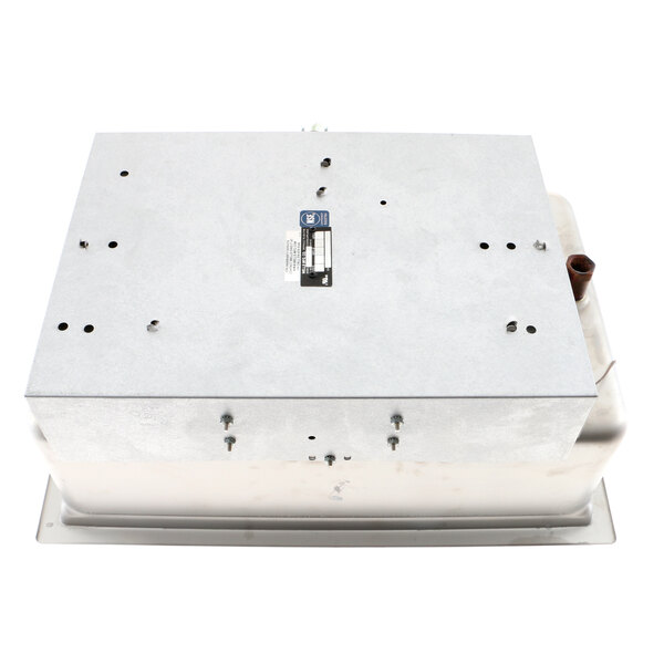 A white metal Wells drop-in warmer with a metal plate on top and screws.