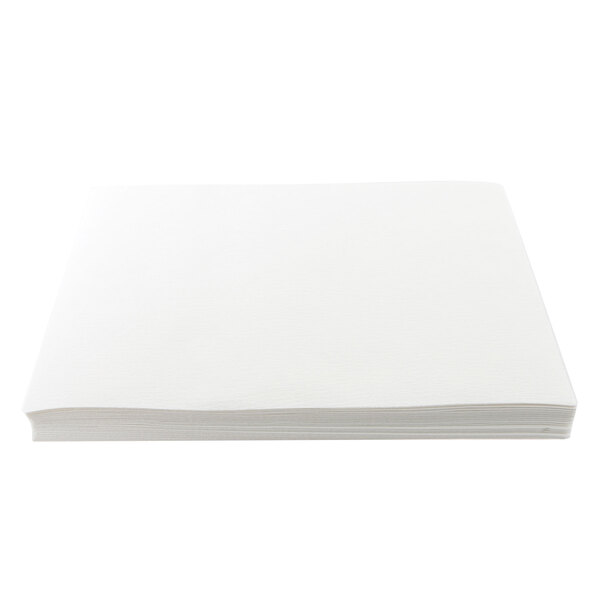 A stack of Giles filter paper on a white surface.