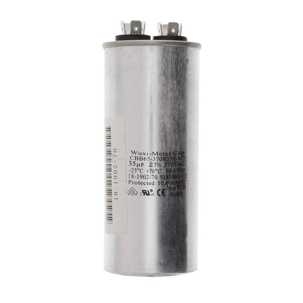 A silver Scotsman run capacitor with a white label.