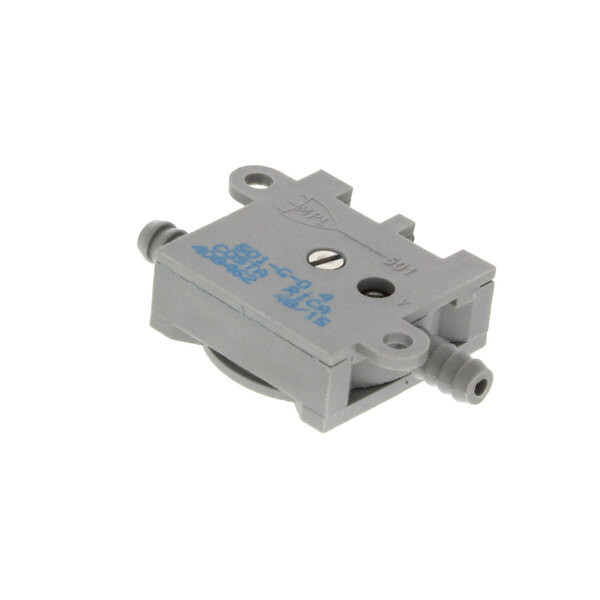 A small grey plastic valve with blue writing.