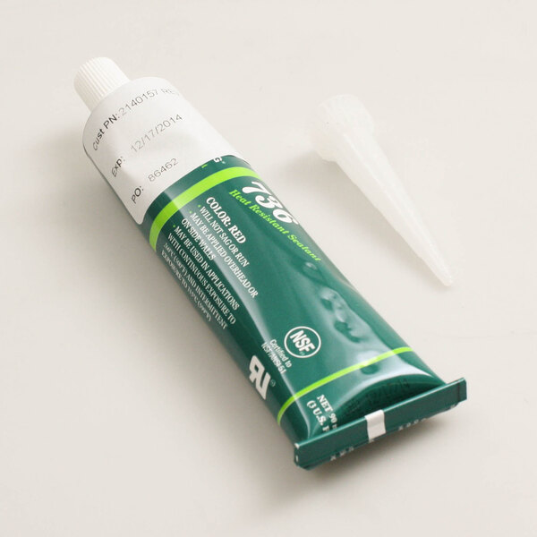 A green Antunes silicone sealer tube with white cap and tip, next to a white Antunes tip.