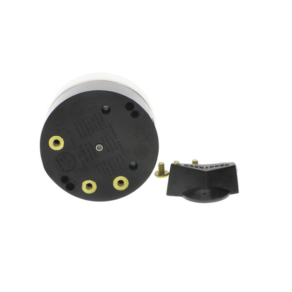 A black and white circular timer with yellow holes.