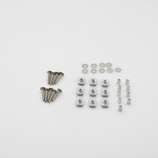 A group of screws and nuts on a white surface.