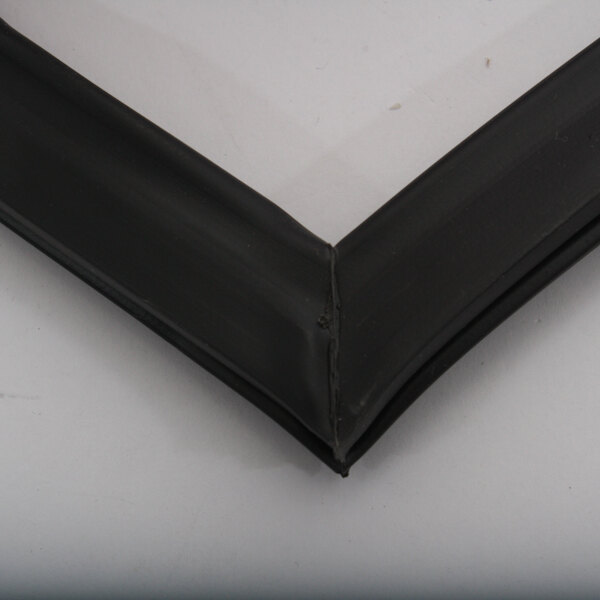 A close up of a black rubber seal with a white background.