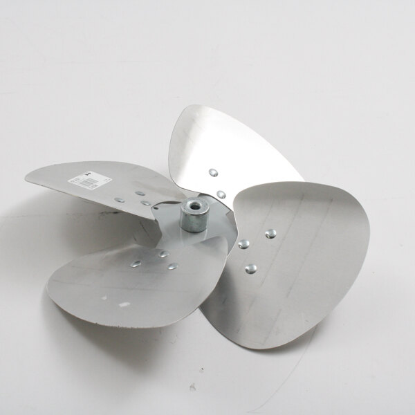 A Master-Bilt metal fan blade with two holes on it.