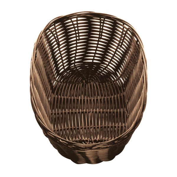 A brown rattan bread basket with an oval shape.