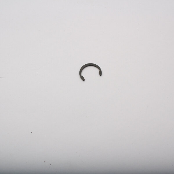 A metal ring on a white surface.