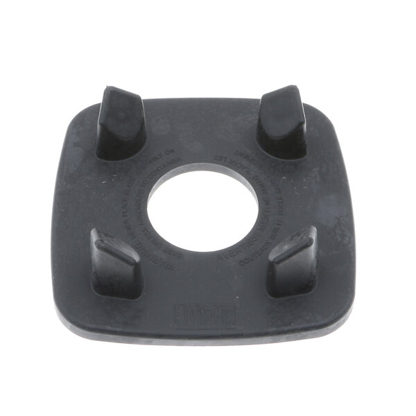 A black rubber Vitamix ring pad with holes in it.