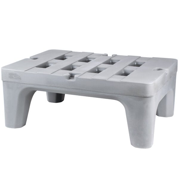 A grey plastic Metro Bow Tie Dunnage Rack with holes.
