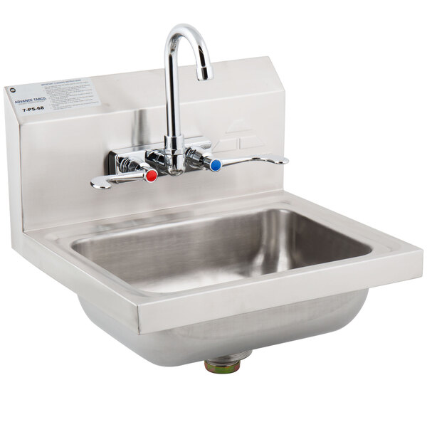 A stainless steel Advance Tabco hand sink with splash mount faucets.