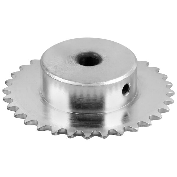 A close-up of a silver metal sprocket with a hole in the center.