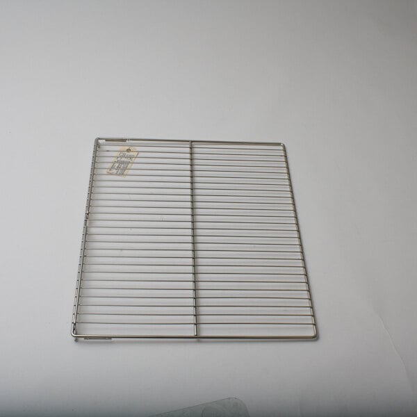 A Duke metal wire rack on a white surface.