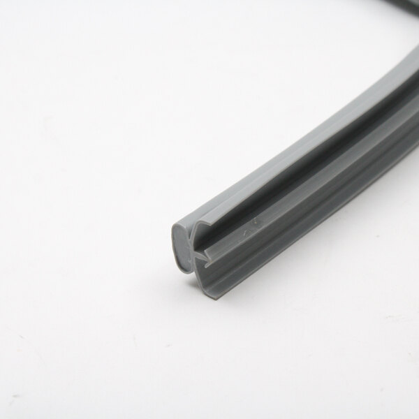 A grey rubber gasket with a grey plastic strip on a white surface.