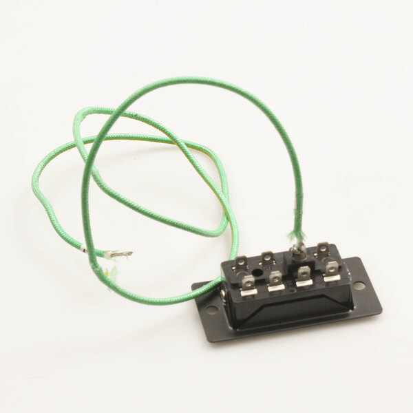 A green wire connected to a black rectangular object using a Blodgett SOCKET & SCREW.