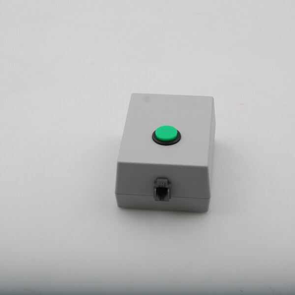 A grey square Duke box with a green button.