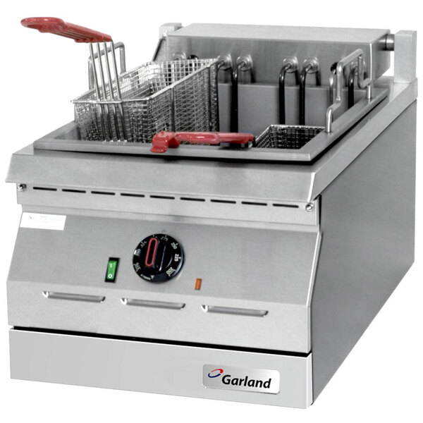 A Garland electric countertop deep fryer with two baskets, one with a red handle.