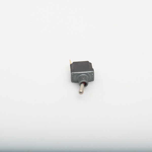A close-up of a small black Accutemp toggle switch on a white surface.