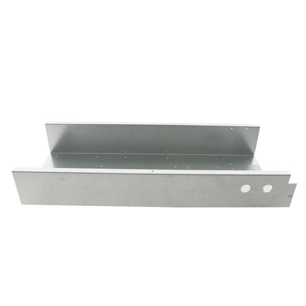 A metal shelf with two holes on it.
