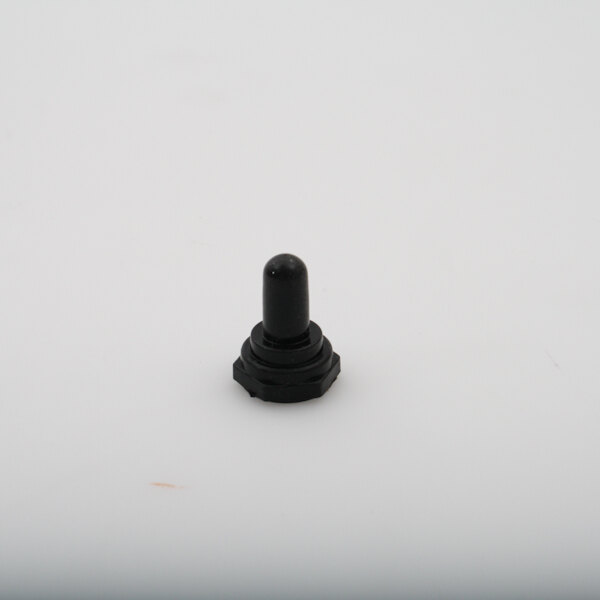 A black plastic boot switch on a white surface.