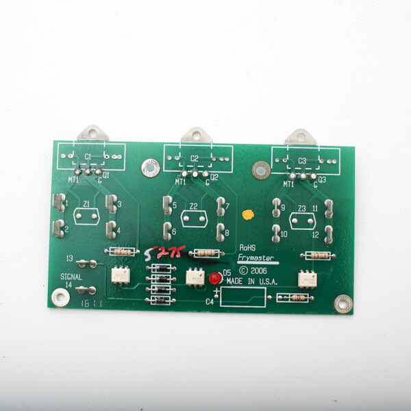 A close-up of a green Frymaster Triac board with four electronic components.