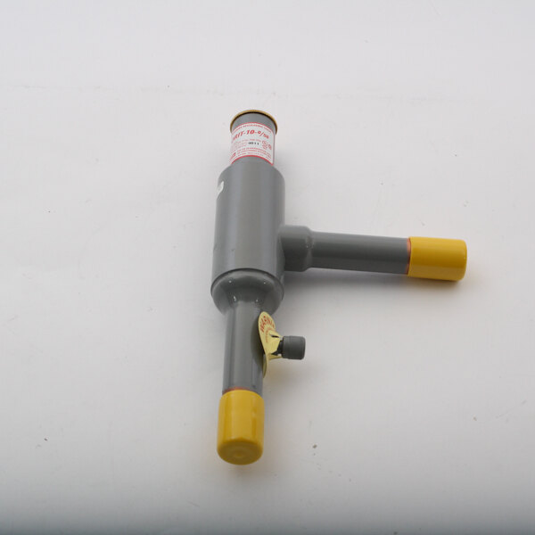 A grey and yellow Scotsman EPR valve on a white surface.