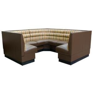 An American Tables & Seating 3/4 circle corner booth with a curved seat and striped cushions.