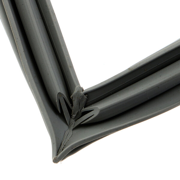 A close-up of a black rubber corner on a grey plastic Metro gasket.