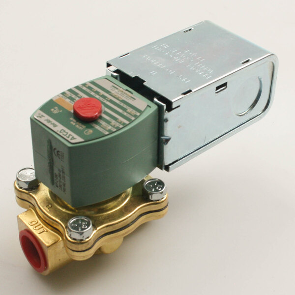 A metal valve with a red button and green handle.